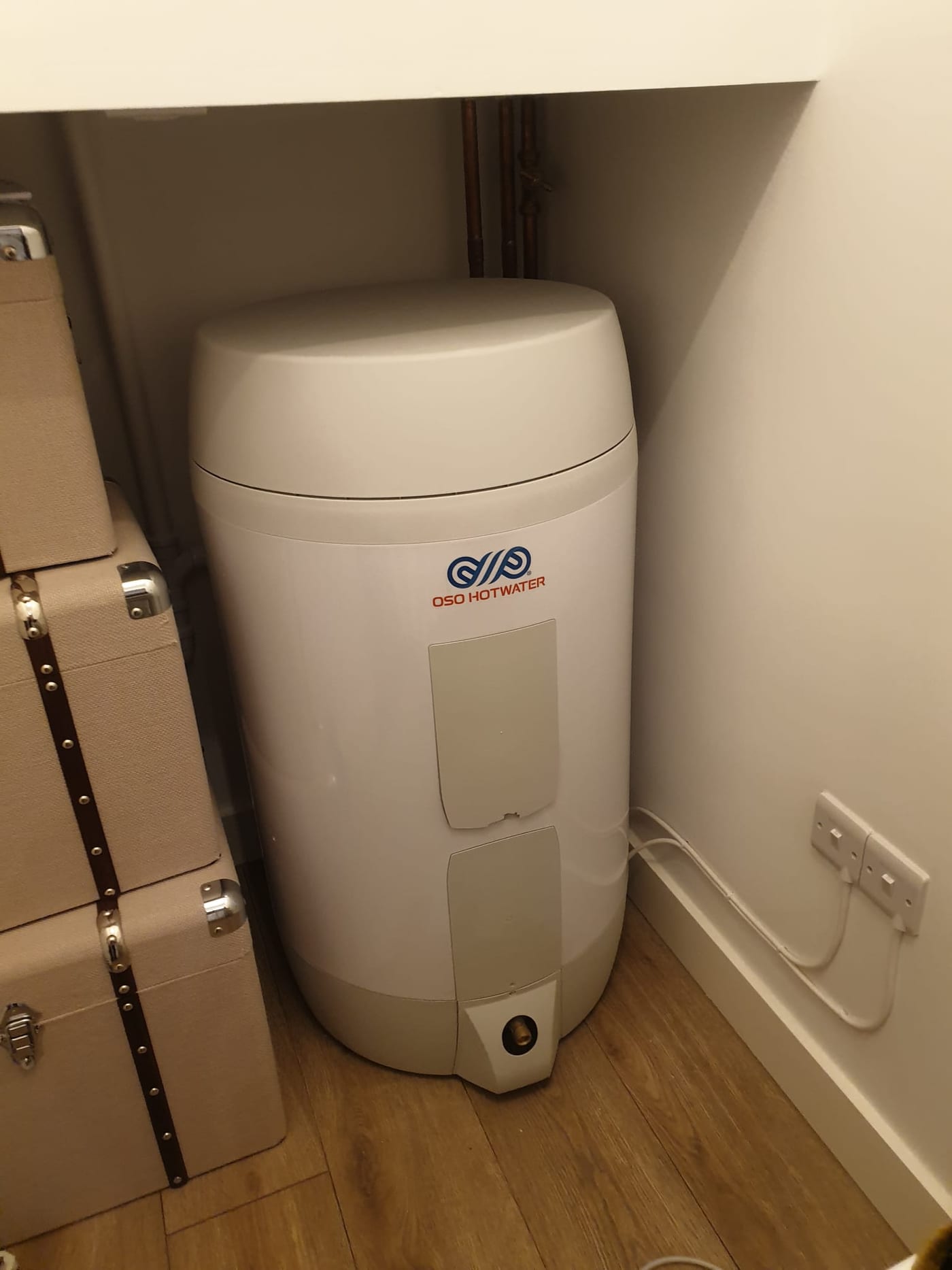 An electric hot water cylinder installation in a Manchester apartment